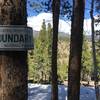 The NPS Boundary signs help with finding the snow-covered trail.