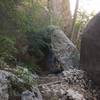 The Bear Canyon Trail passes under a "leaning boulder" in this section.