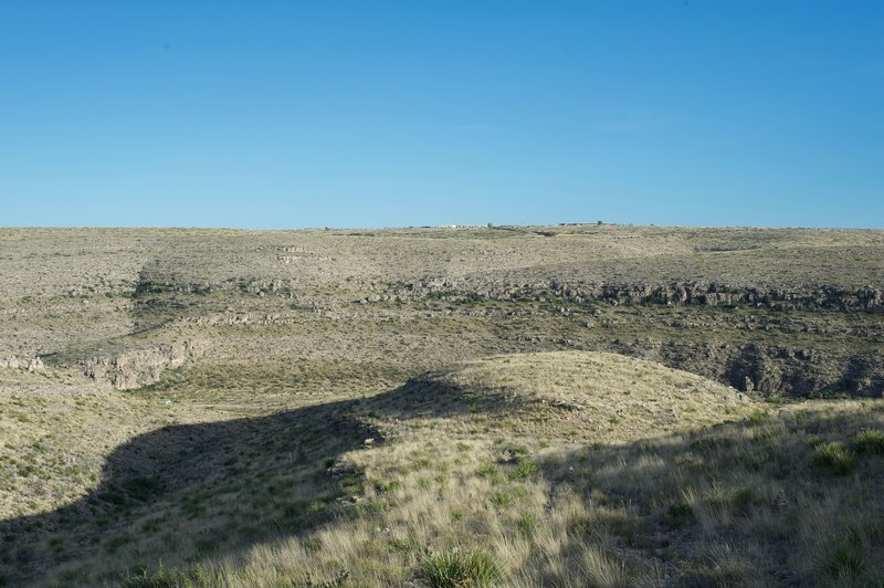 The Carlsbad Caverns Visitor Center sits on the hillside far across the canyon.