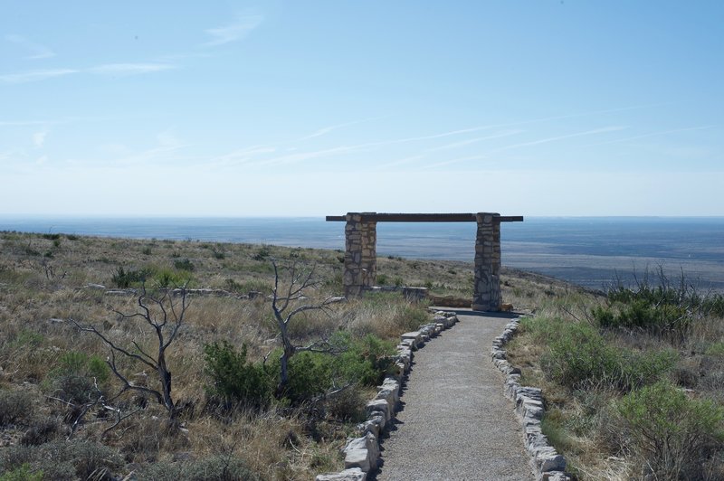 There is a small seating area with views of the New Mexico and Texas countryside from the top of the ridge.