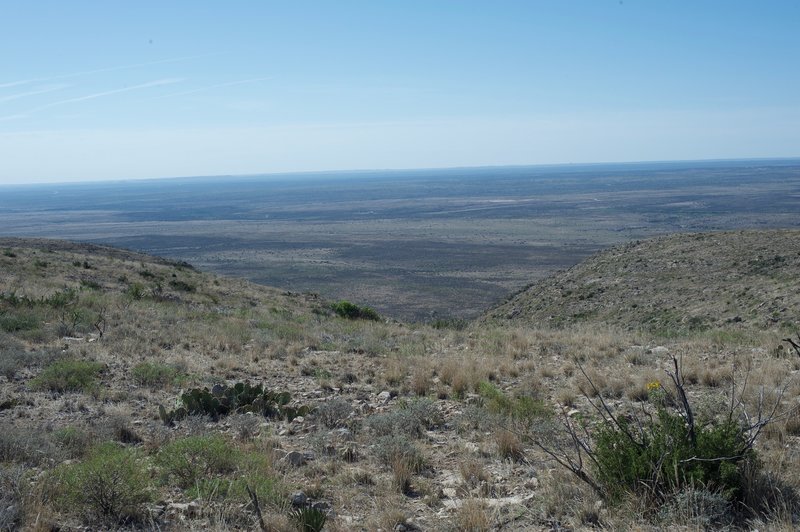 The view of the surrounding countryside spread out before you. Flowers can be seen blooming in the spring.