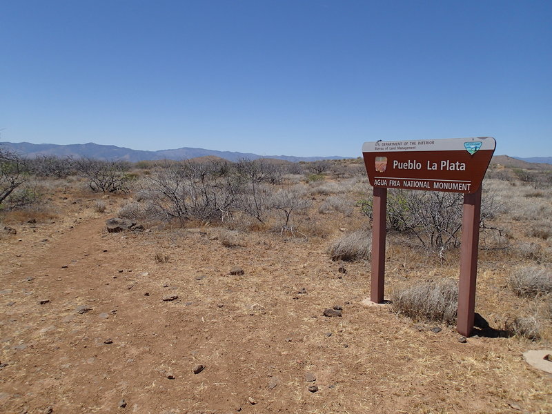 Look for this sign to make sure you're at the right parking area for Pueblo La Plata.