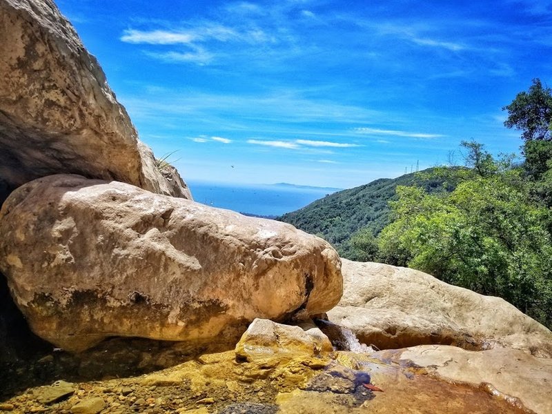 The base of Tangerine Falls offers a great look toward Channel Islands State Park.