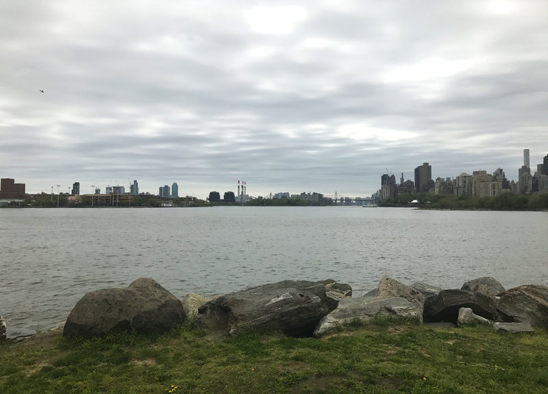 The view from the trail over the East River is great. Left to right: Astoria, Queens (tall red smokestacks are Ravenswood Generating Station in Queens; Roosevelt Island; Queensborough Bridge; Upper East Side of Manhattan.