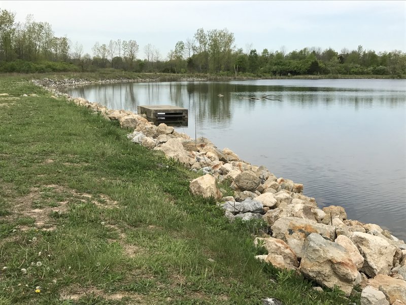 A cement dock on the Blue Trail looking over Argonne Lake and towards the prairie on the Orange Trail.