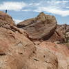 Valley of Fire rocks dwarf a hiker.