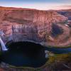 The sun sets over Palouse Falls.