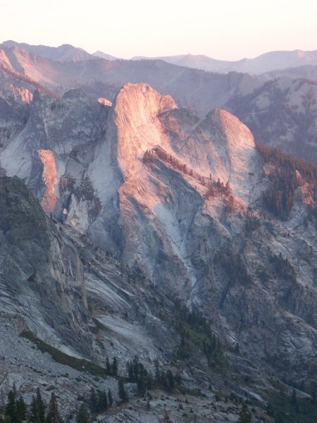 The sun sets on a rock fin west of Mt. Stewart.