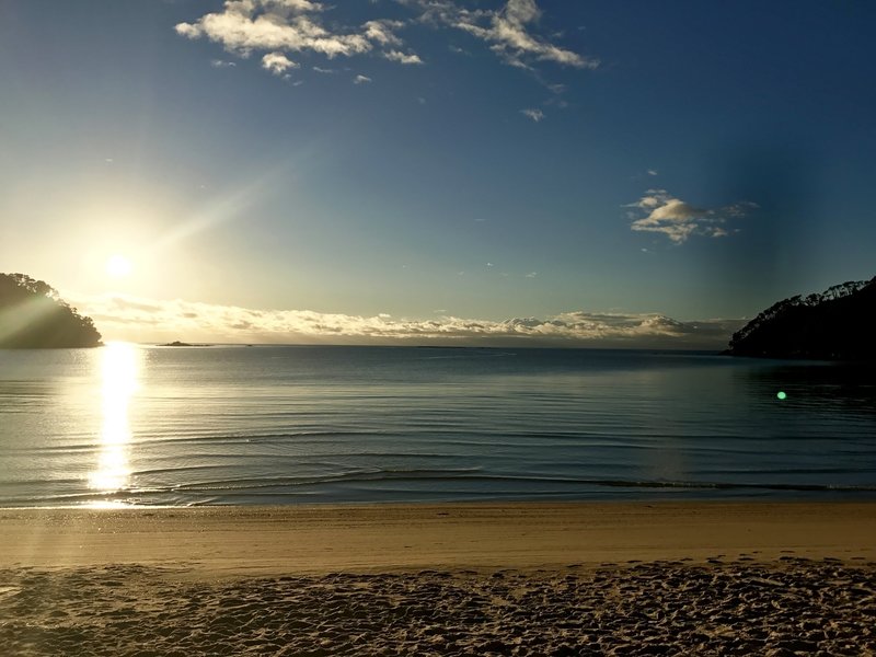 The sun rises over Bark Bay.