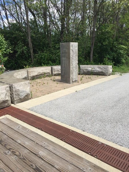 Stone benches create a place to rest your feet and enjoy some sunshine.