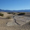 Sandstone makes the base of the Mesquite Sand Dunes.