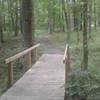 A sturdy footbridge aids your passage along the trail.