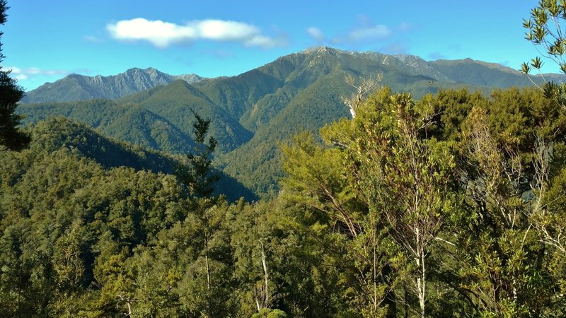 The Heaphy Track offers spectacular vistas overlooking the Aorere River Valley and the Tasman Mountains.