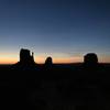 The sun rises over a sleeping Monument Valley.