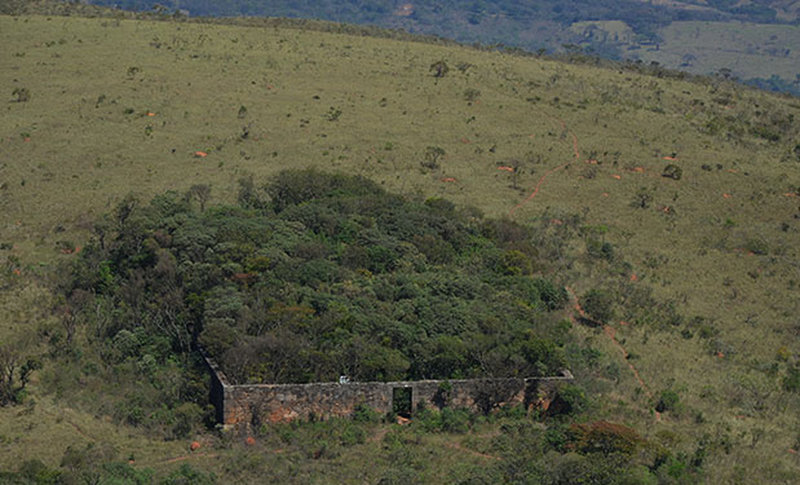 An old overgrown fort sits along the trail.