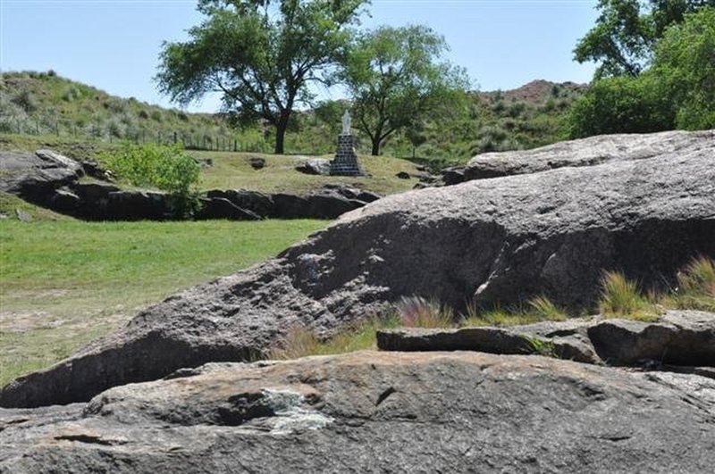 The climb to the cross is complete with pleasant grasses and interesting rock formations.