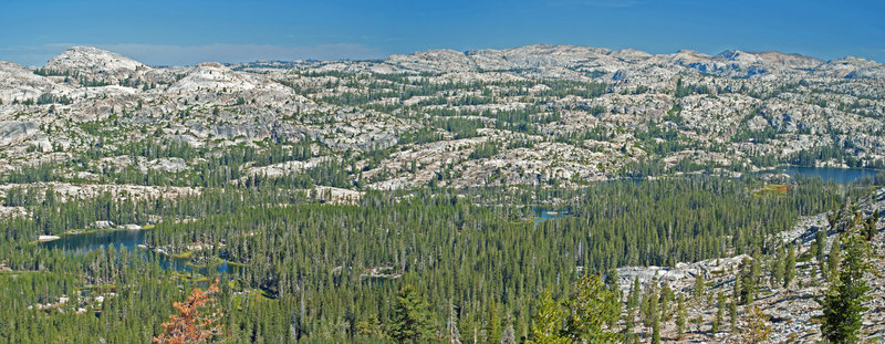 From the climb to Fawn Lake, the view shows all of Huckleberry Lake and a panorama of the Emigrant Wilderness.