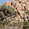 A well-shaded visitor travels along the Barker Dam Nature Trail. Photo credit: NPS/Brad Sutton.