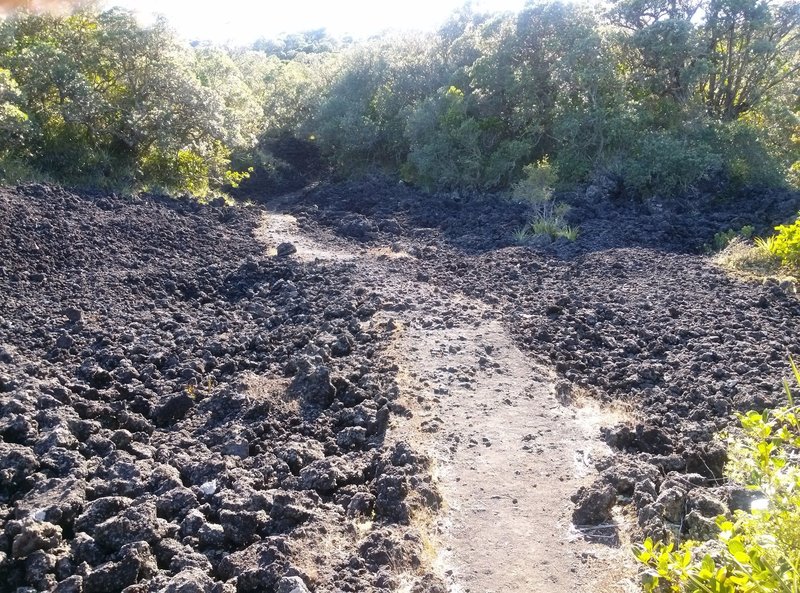 Watch your footing as you make your way to the summit through the volcanic basalt.