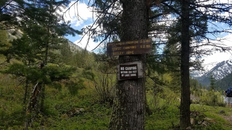 The trail marker at Upper Palisades Lake lays down the camping rules.