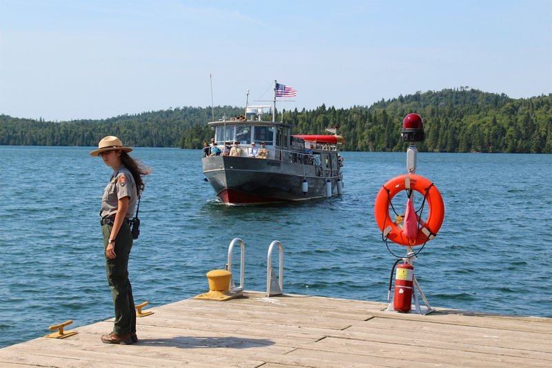 A park ranger awaits the arrival of the ferry at Isle Royale Park.