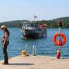 A park ranger awaits the arrival of the ferry at Isle Royale Park.