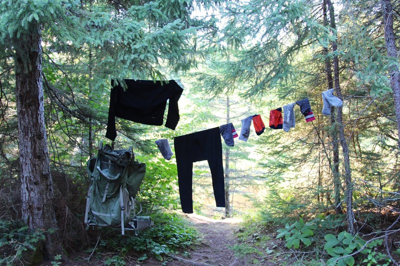 Someone's belongings hang to dry near the trail and Washington Creek Campground.