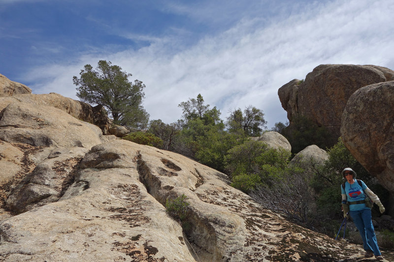 A hiker explores the rocks just east of the Warner Springs section of the PCT.