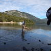 An adventurer crosses the Rio Hermoso to start the loop!