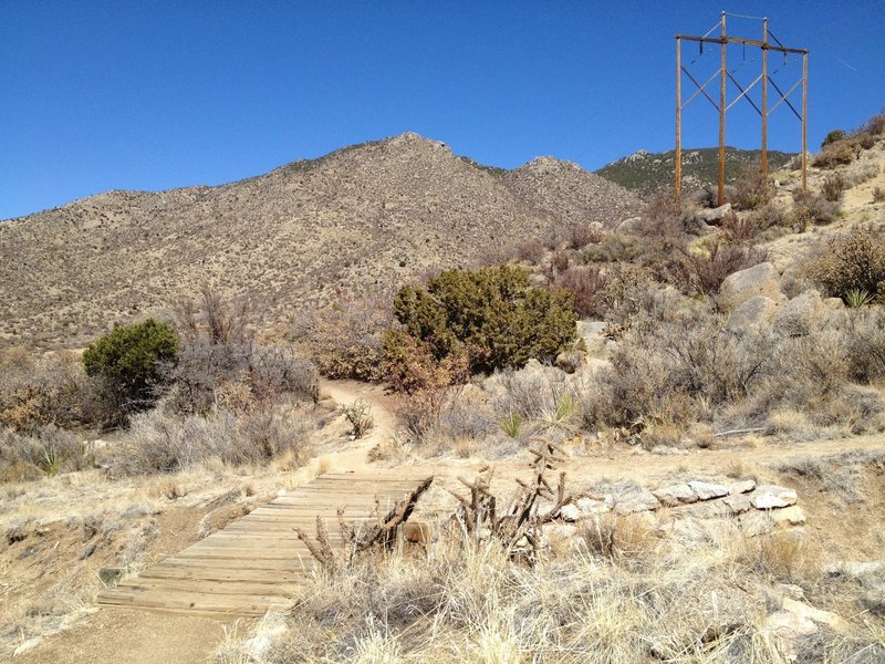 A wooden bridge over an arroyo on the Lower Foothills Trail 365.