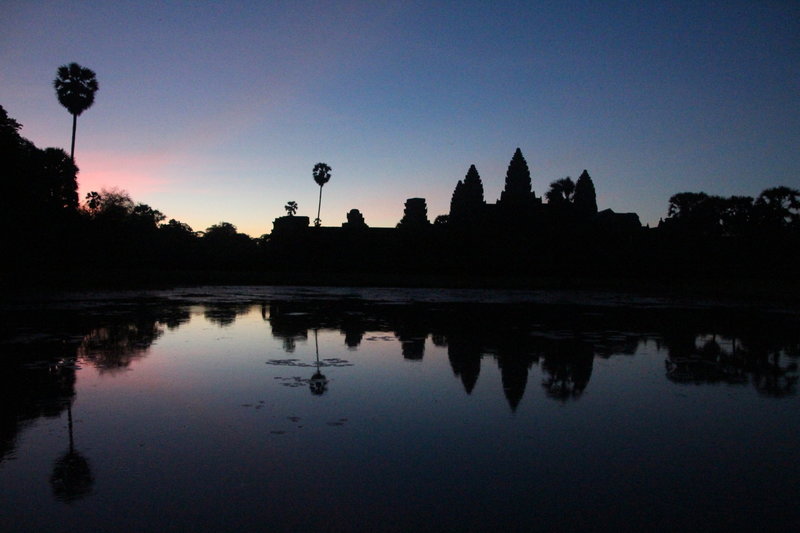 Sunrise from the nearby reflection pool within Angkor Wat.