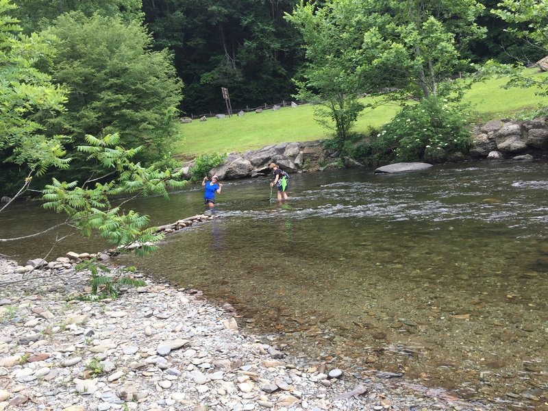 We found a nearby shallower area to cross the river. Ended up being about waist-high in June. Watch for snakes in the rocks, too.