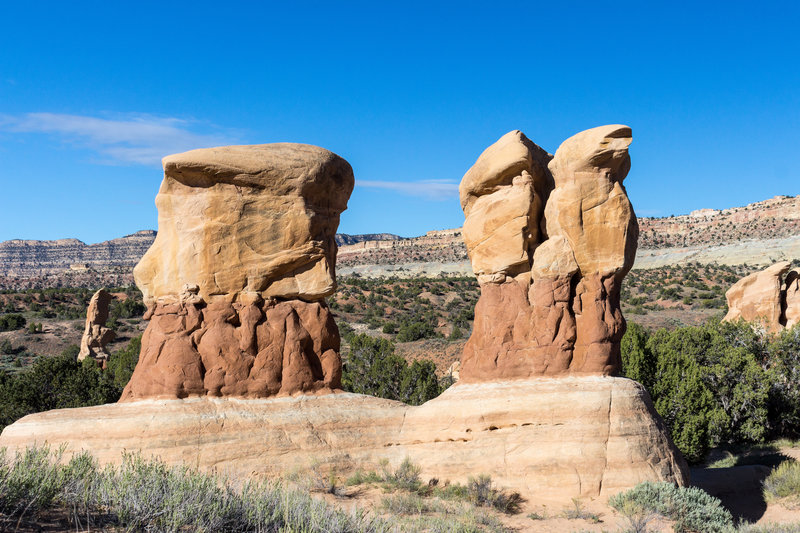 Hoodoos continue to be sculpted in Devils Garden while Fiftymile Mountain stands in the background.