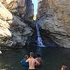 A teenager gets ready to jump off the cliff.