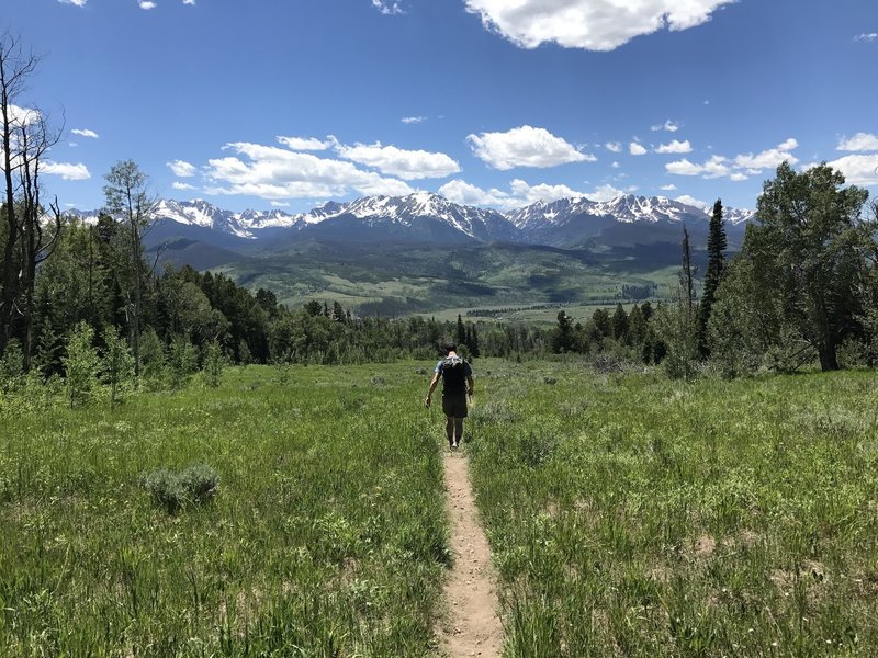 Heading down the Acorn Creek Trail with expansive views of the Gore Range to the west.