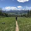 Heading down the Acorn Creek Trail with expansive views of the Gore Range to the west.