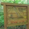 Rebman Trailhead is marked by a big wooden sign.