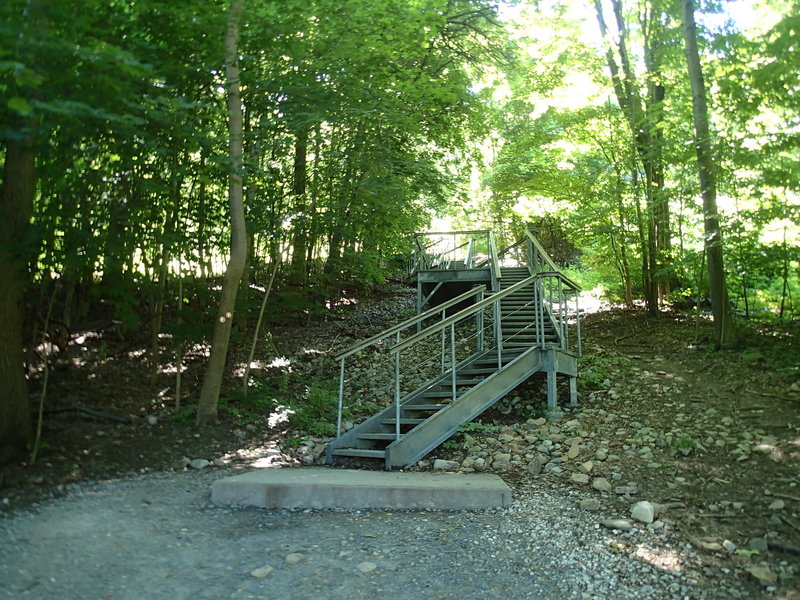 After the gravel path from the parking area is this steel staircase. Upon reaching the top, get ready for a steep trail!