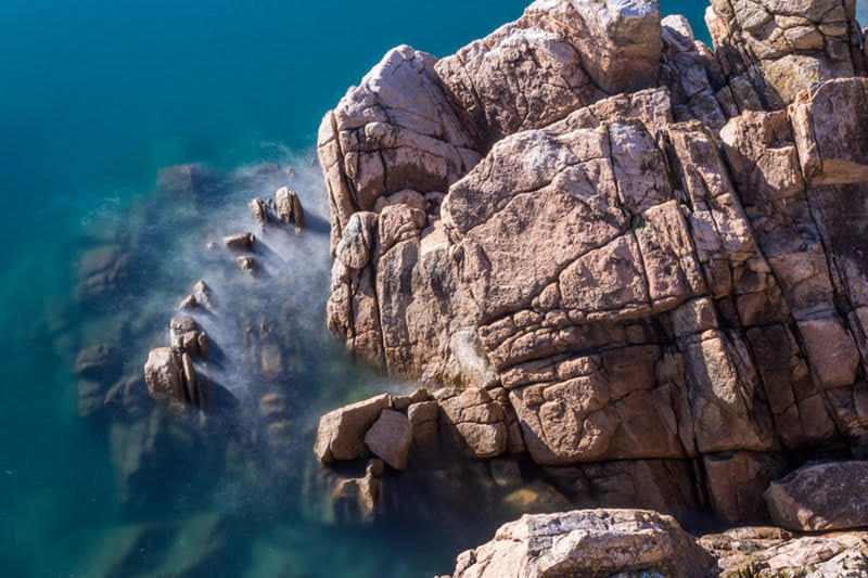 Look down from the trail into the crystal clear waters at Separation Point.