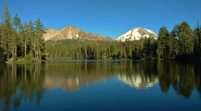 Chaos Crags (left) and Mt. Lassen (right) stand over the east end of Reflection Lake.