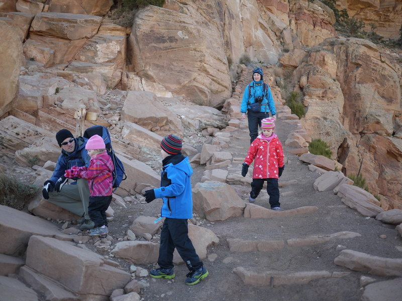 A French family hikes down the South Kaibab Trail near Ooh Aah Point.