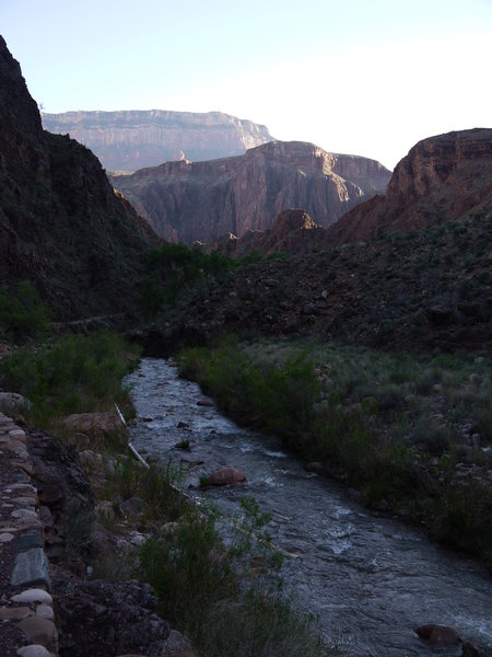 Late-afternoon light trickles through Colorado Canyon at the mouth of Bright Angel Creek.