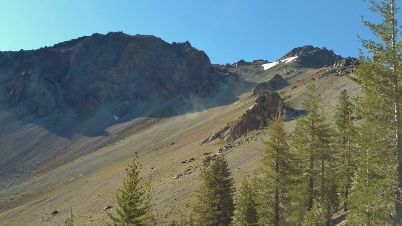 This is Chaos Crags. A rockslide (dust cloud in upper center) is coming down. Chaos Crags is a cluster of six dome volcanoes that last erupted about 1,000 years ago.