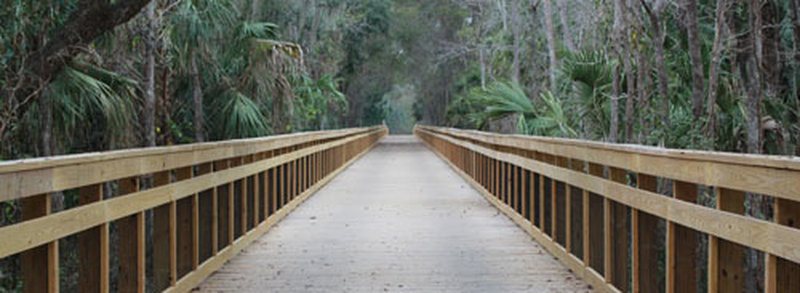 A massive wooden bridge aids your passage along the East Central Rail Trail.