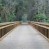 A massive wooden bridge aids your passage along the East Central Rail Trail.