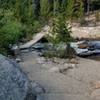 The bridge across Roaring River has been rebuilt, providing easy access to the Ypsilon Trail.