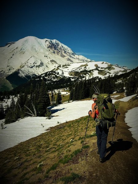 A backpacker heads across Sourdough Ridge toward the Northern Loop.