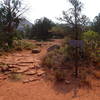 This sign marks the trailhead at Vultee Arch Road.