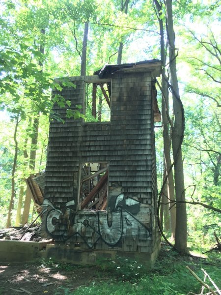 Ruins of an old house, maybe a mill house, with graffiti.