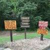 Signs at trailhead for kayak and canoes.